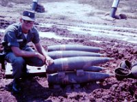 Ken Boone checking out a 175mm round.